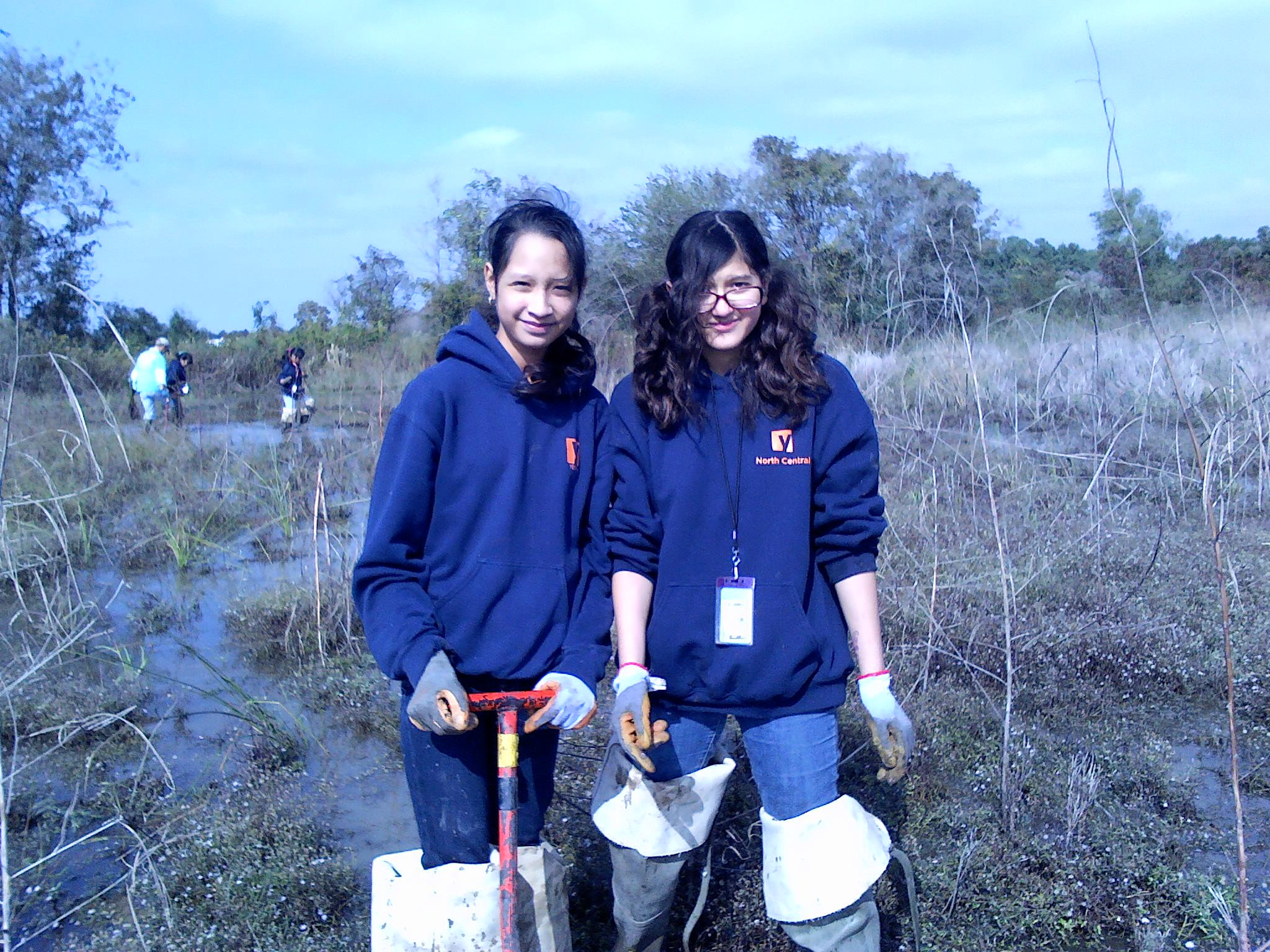 two girls posing with a dibble.