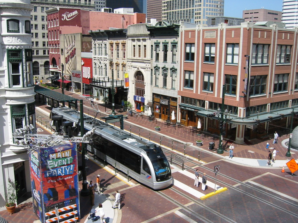 Light rail train at an intersection.